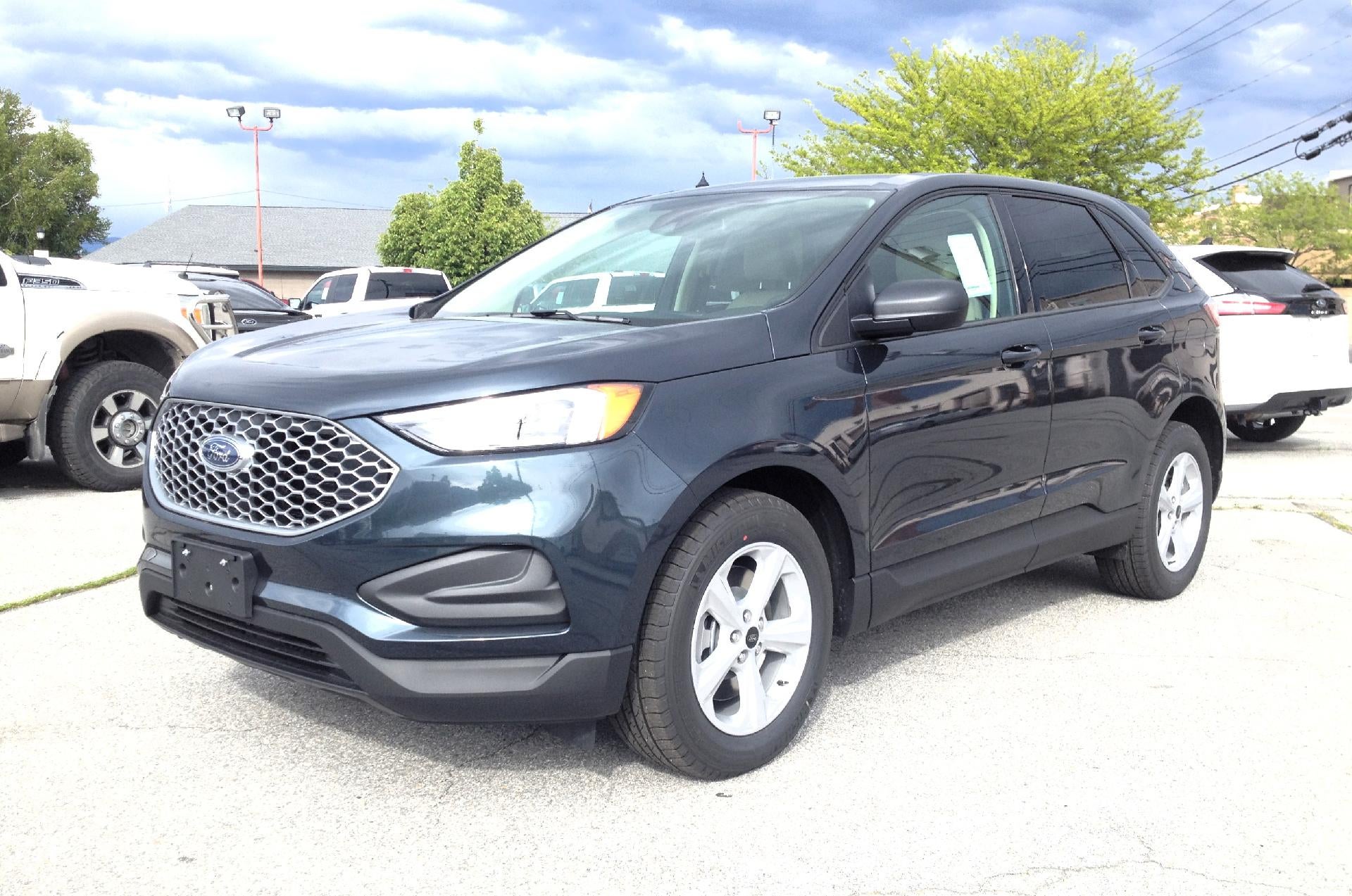 2024 Ford Edge SE AWD in Stone Blue Metallic — front three-quarter view